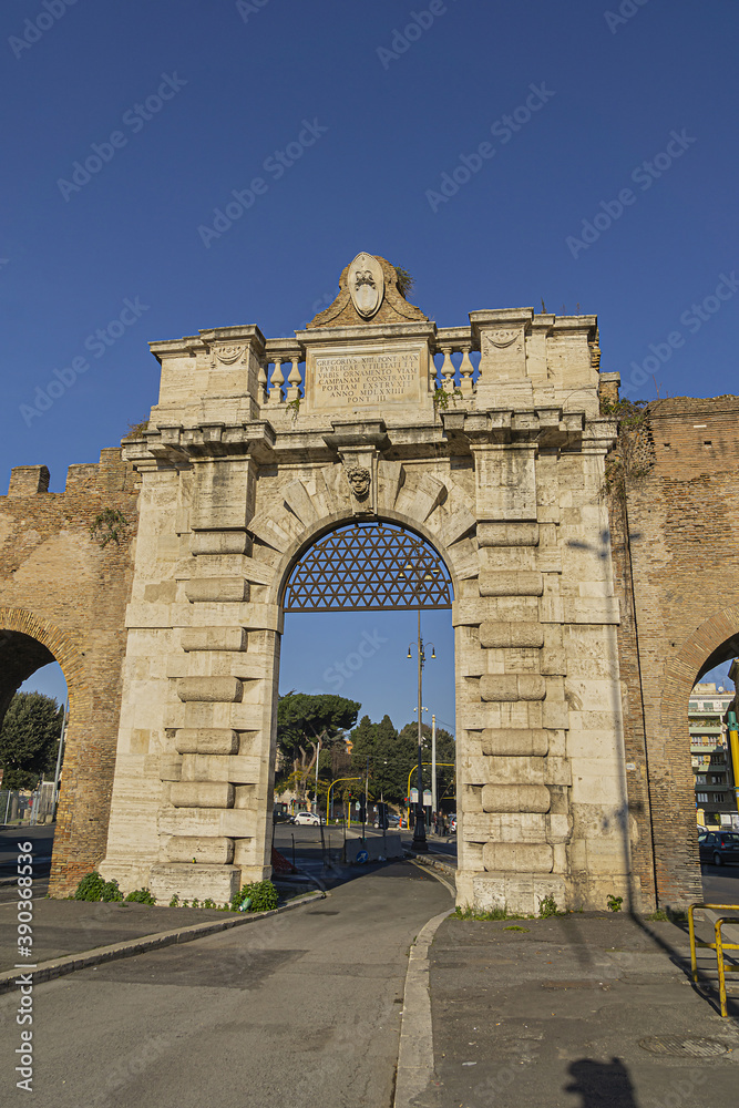 Fototapeta premium Aurelian Wall and Porta San Giovanni (San Giovanni gate, 1574) in city Rome. Italy.