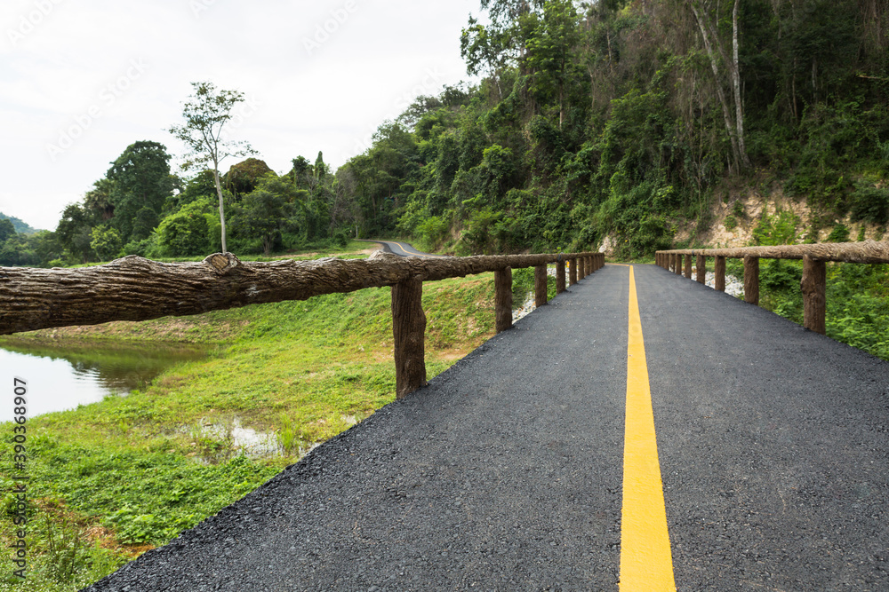 Bike lane at Namtok Samlan National Park in Saraburi Thailand is a reservoir that tourists come to relax or camping during the holiday Bike lane at Namtok Samlan National Park in Saraburi Thailand is a reservoir that tourists come to relax or camping during the holiday
