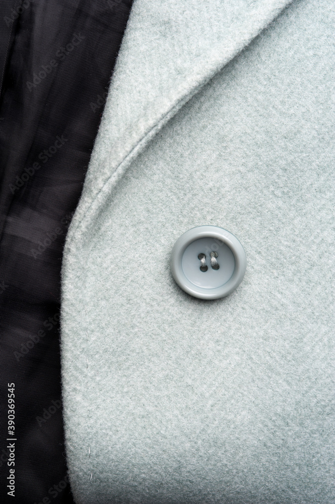 Detail of light blue female coat. Concept of warm everyday things. Detail of light blue female coat. Concept of warm everyday things.