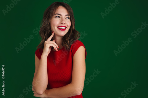 Beautiful happy brunette girl smiling and looking aside