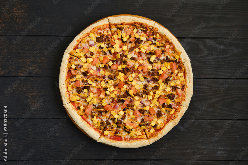 Top view of pizza with minced meat, tomato, onion and cheddar Top view of pizza with minced meat, tomato, onion and cheddar