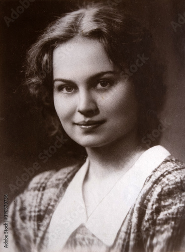 Portrait of beautiful young woman, 1950s archive photo from family album