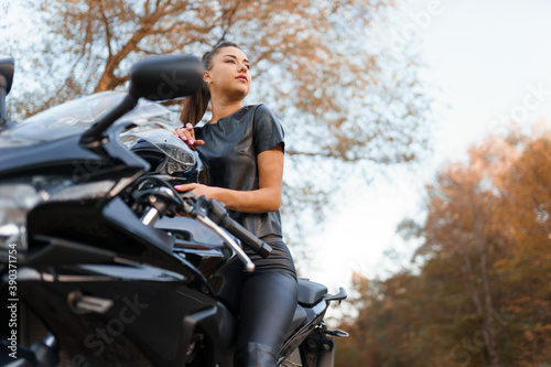 Beautiful girl on a sports motorcycle