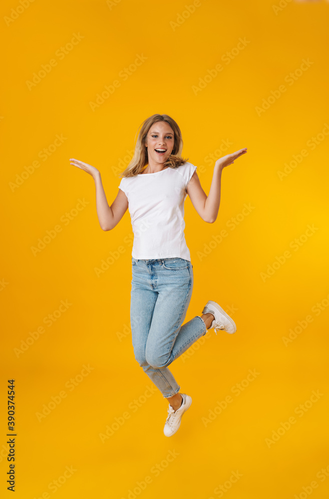 Delighted beautiful girl smiling while showing copyspace Delighted beautiful girl smiling while showing copyspace