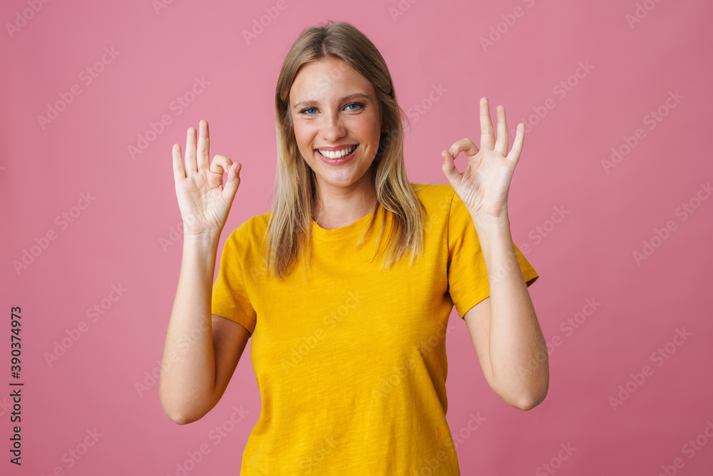 Cheerful beautiful girl smiling and showing ok sign Cheerful beautiful girl smiling and showing ok sign