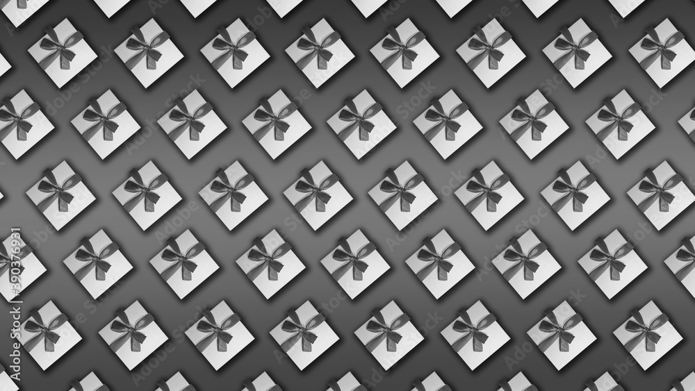 White boxes with ribbons on a gray background. White boxes with ribbons on a gray background.