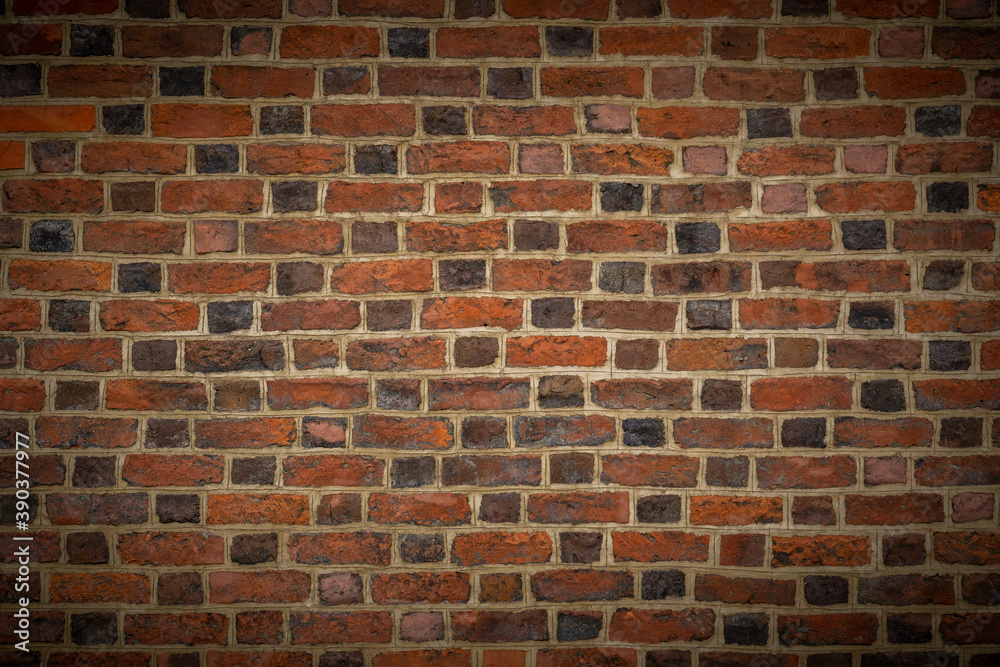 brick wall with several shades of brown with vignetting. wallpaper, background brick wall with several shades of brown with vignetting. wallpaper, background