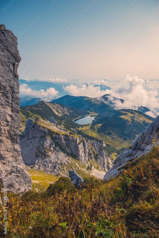 landscape with clouds in the austrian alps with mountain and lake at Rofan region  Ziereiner See in Kramsach, Tyrol 