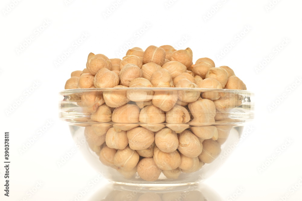 Uncooked hummus grains, close-up, isolated on white. Uncooked hummus grains, close-up, isolated on white.
