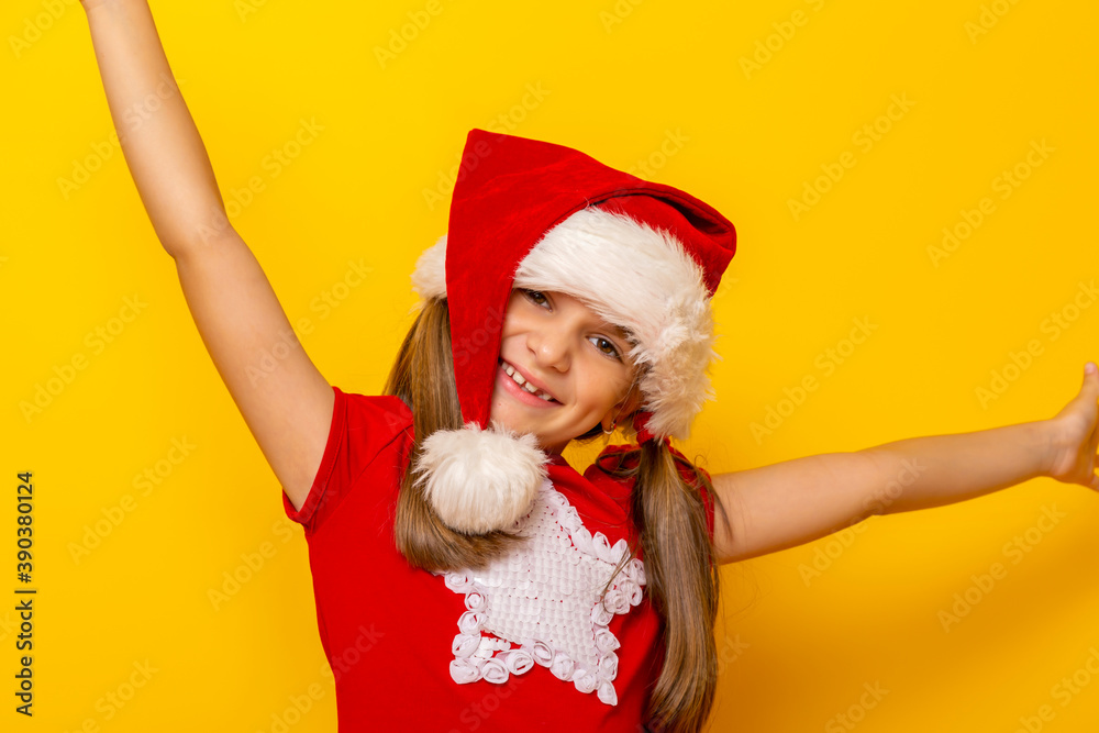 Little girl wearing Santa hat holding hands up Little girl wearing Santa hat holding hands up