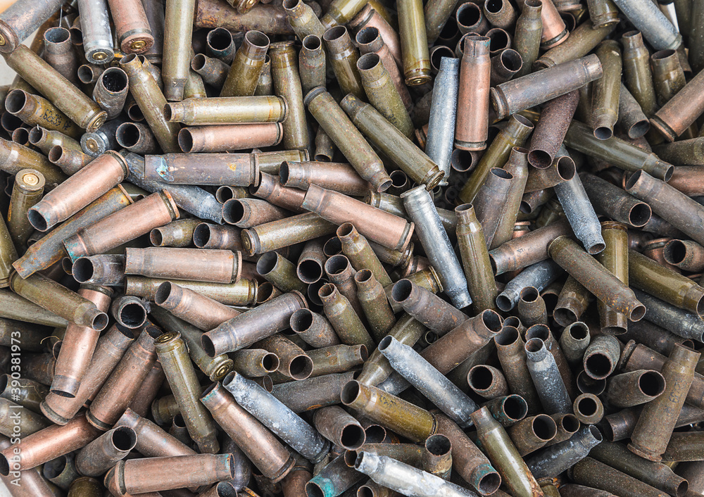 Old used bullet shells background Old used bullet shells background