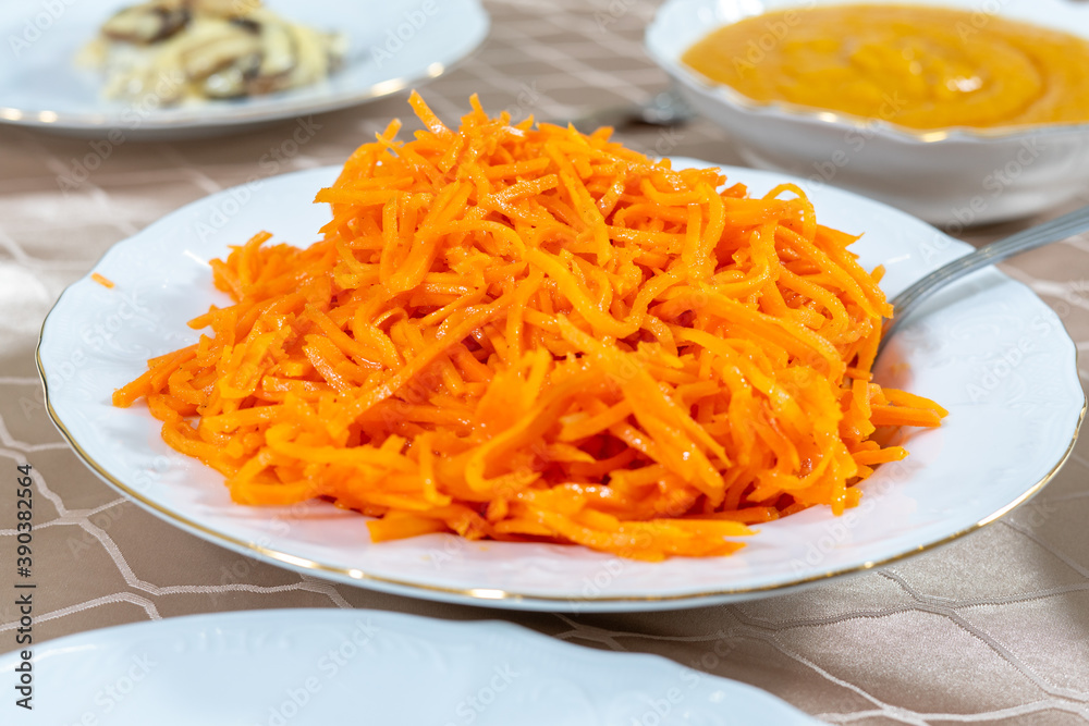 Korean spicy carrot salad on the table Korean spicy carrot salad on the table