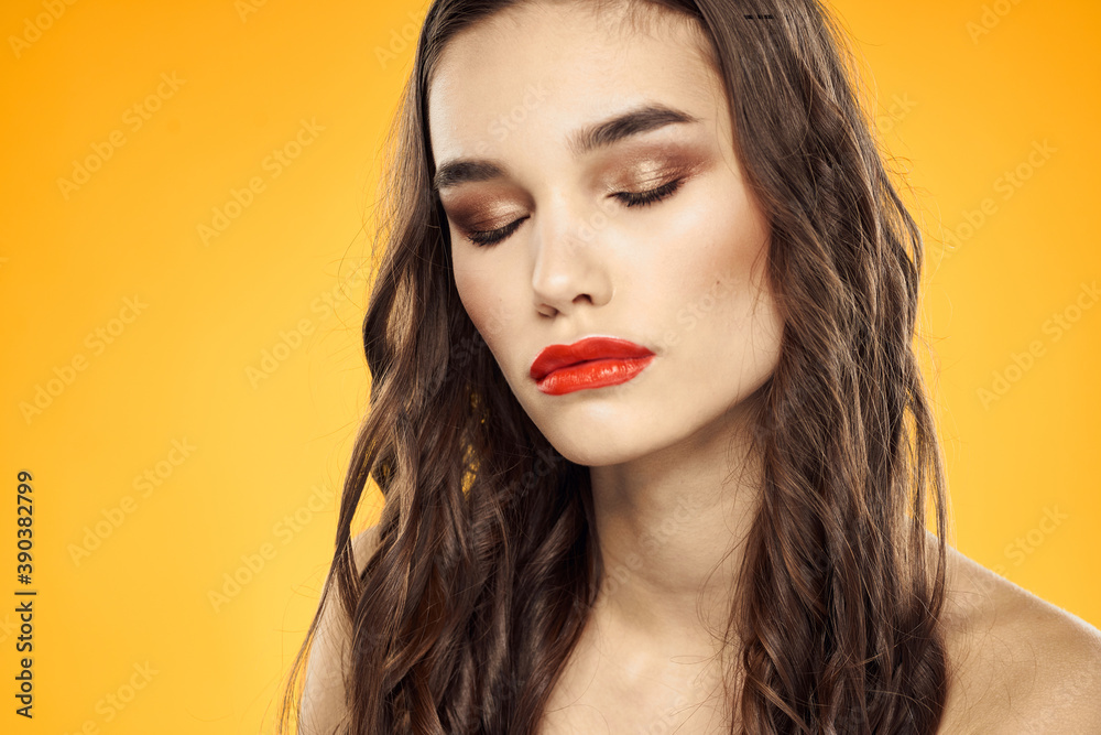 Woman with bare shoulders red cropped lips charm yellow background Woman with bare shoulders red cropped lips charm yellow background