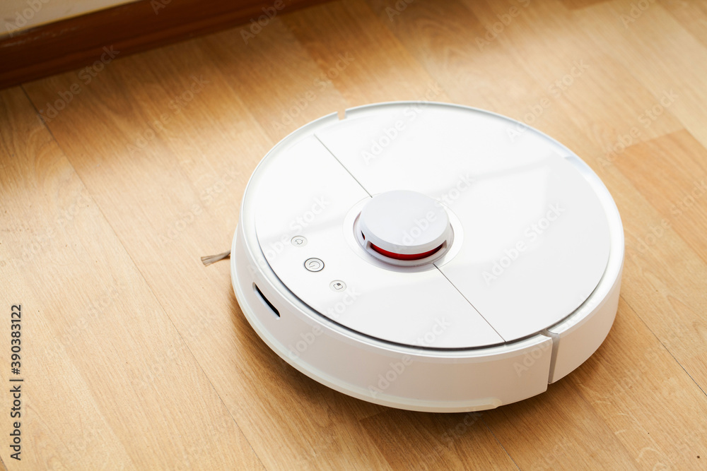 Robot vacuum cleaner performs automatic cleaning of the apartment at a certain time. Smart home. Robot vacuum cleaner performs automatic cleaning of the apartment at a certain time. Smart home.