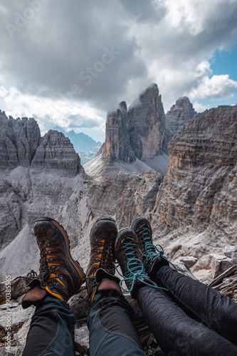 sitting on the edge at unesco world heritage region Dolomites Italy Tre Cime di Lavaredo