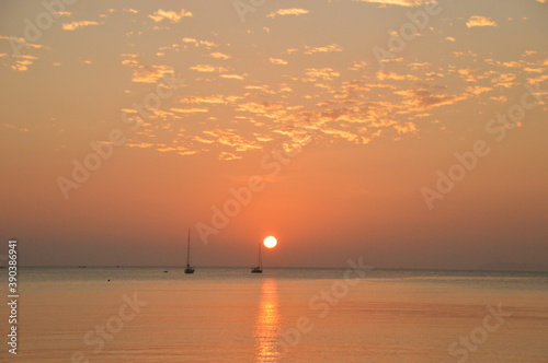 Sunset on the beaches of the untouced island of Ko Phayam in the Andaman Sea, Thailand photo