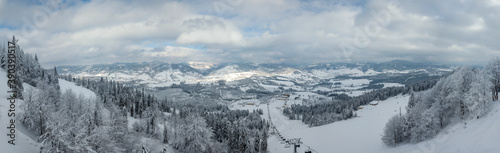 Aerial drone panorama of winter snowy Carpathians. 