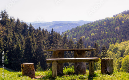Landscape in mountains with wood bench
