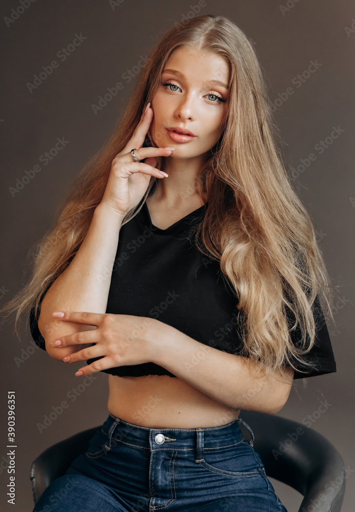 Close up studio portrait of a pretty blonde woman in black top. Close up studio portrait of a pretty blonde woman in black top.
