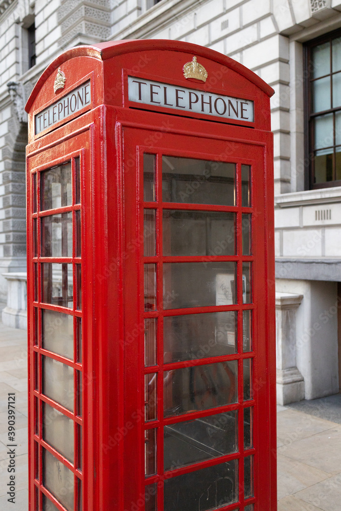 Red iconic telephone booth on the street Red iconic telephone booth on the street
