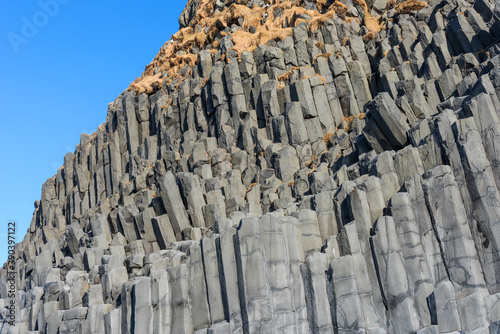 Black basalt columns of Reynisfjara, famous black-sand beach in the South Coast of Iceland. Reynisfjara Black Sand Beach in Iceland.