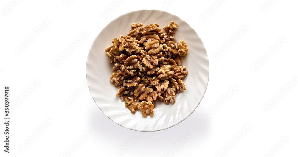 Walnuts in a white plate isolated Walnuts in a white plate isolated