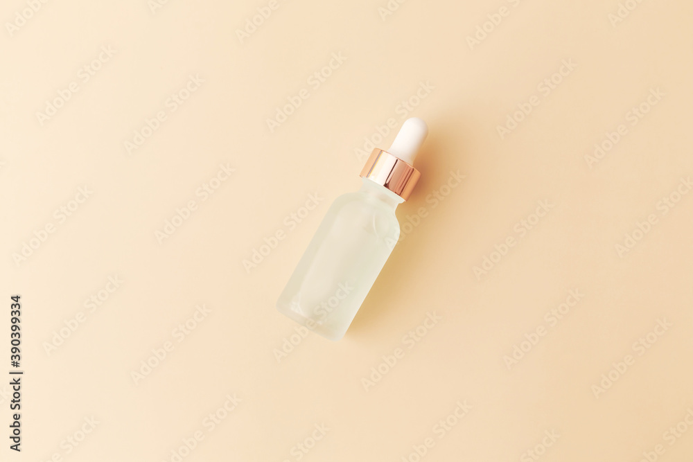 Glass bottle with pipette on white background. Top view, flat lay, copy space. Glass bottle with pipette on white background. Top view, flat lay, copy space.