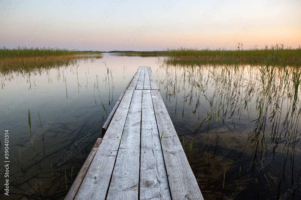 wooden boat dock on a small lake
