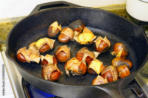 Roasting fresh chestnuts in a cast iron pan