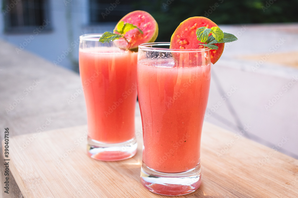 Close up shot of glass of organic Guava juice with fresh guava Close up shot of glass of organic Guava juice with fresh guava