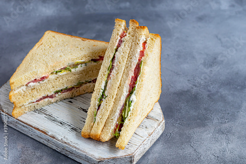 Bild auf Leinwand Sandwich with ham, cheese and fresh tomatoes, salad and toasted bread