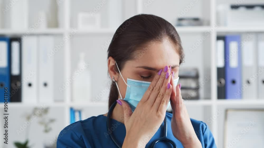 Professional medical doctor in hospital office, Portrait of young and attractive female physician in protective mask. Professional medical doctor in hospital office, Portrait of young and attractive female physician in protective mask.