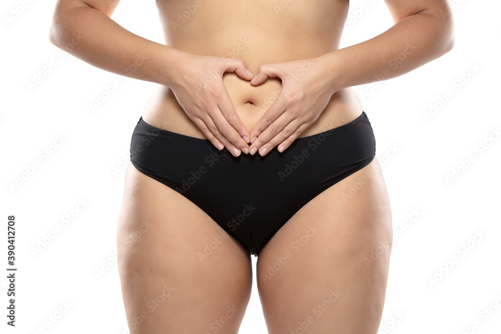 Love herself. Overweight woman with fat cellulite legs and buttocks,  obesity female body in black underwear isolated on white background. Orange  peel skin, liposuction, healthcare and beauty treatment Stock Photo