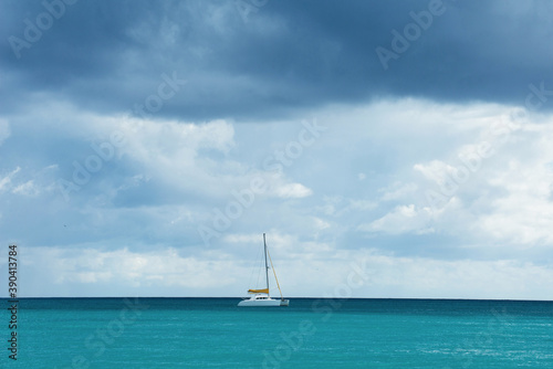 Sailing Boat in the sea with a sky