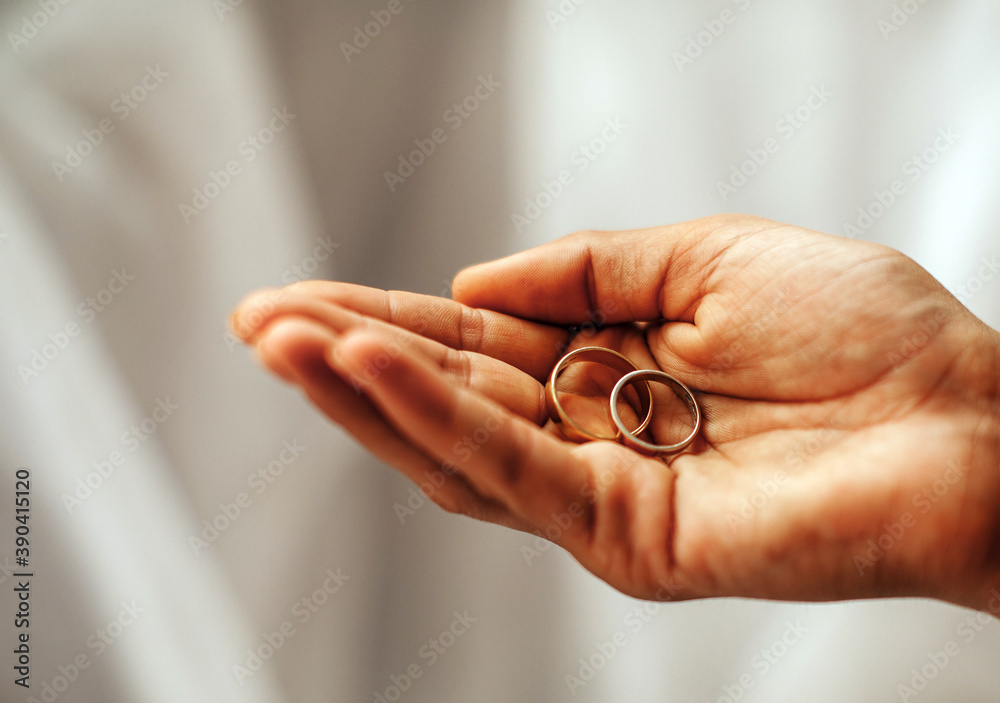 Wedding rings. Woman hand holding wedding rings. Love concept. Female. Dating. Married. Wedding rings. Woman hand holding wedding rings. Love concept. Female. Dating. Married.