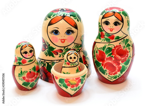 Several disassembled and assembled nesting dolls are shown in close-up