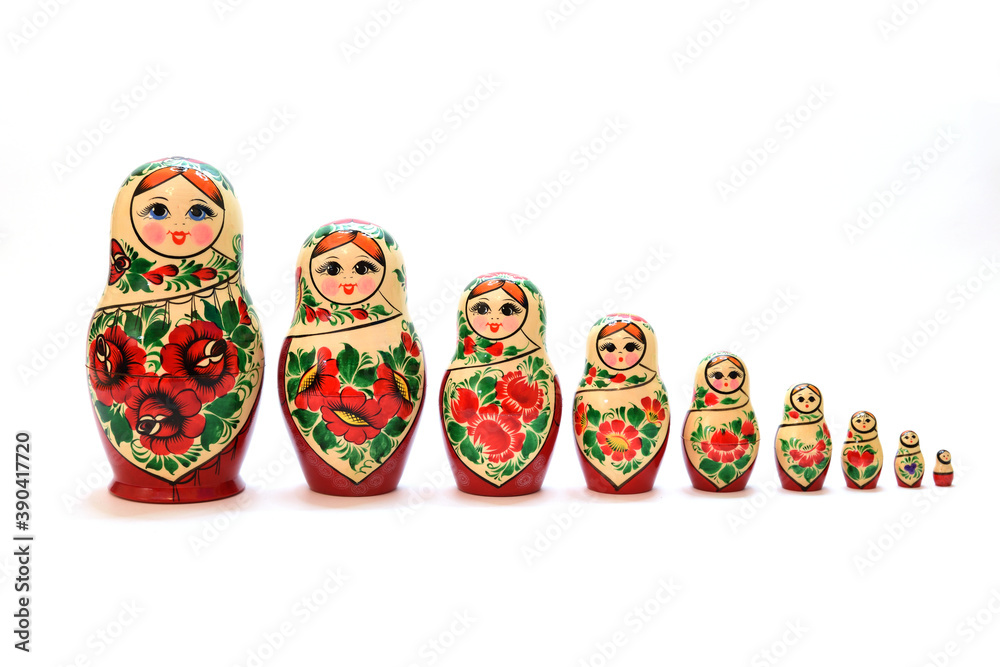 A set of nesting dolls lined up from largest to smallest