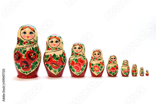 A set of nesting dolls lined up from largest to smallest photo