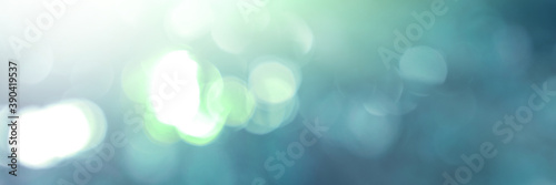 Blue light leaves blurred and blur natural abstract. Effect sunlight  soft bright shiny style  bokeh circle yellow and orange blurry morning . For wallpaper backdrop and background.
