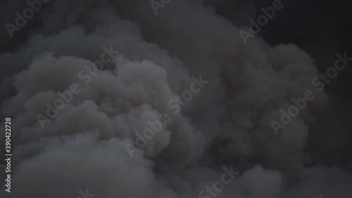 Forest fire dark and thick smoke closeup shot photo