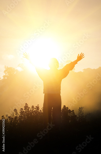 Children raise hands and sunlight