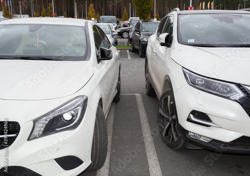 Two new white cars on the city parking. © AGITA LEIMANE