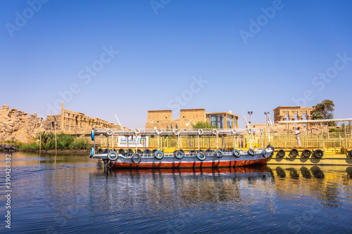 Traditional transport boats to the temple of Philae  a Greco-Roman construction seen from the Nile river  a temple dedicated to Isis  goddess of love. Aswan. Egyptian