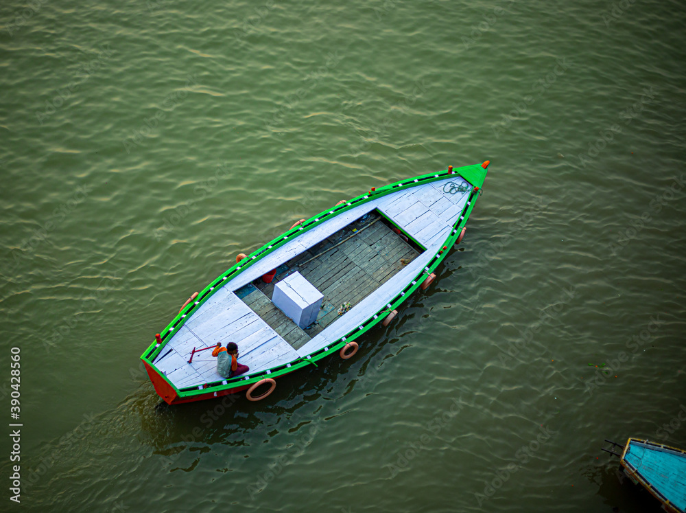 Aerial view of a boatman boating on the River  ganges at varanasi