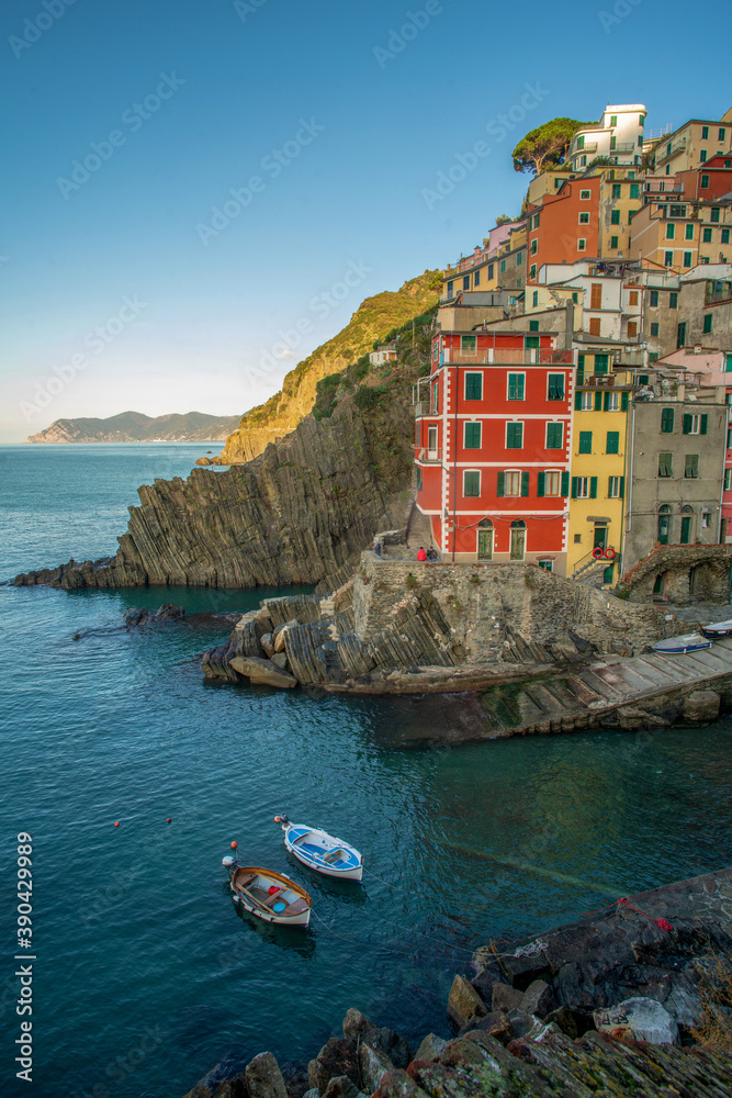 Riomaggiore town on Liguria coast in Italy -  fanatstic small colorful building on rocky hill