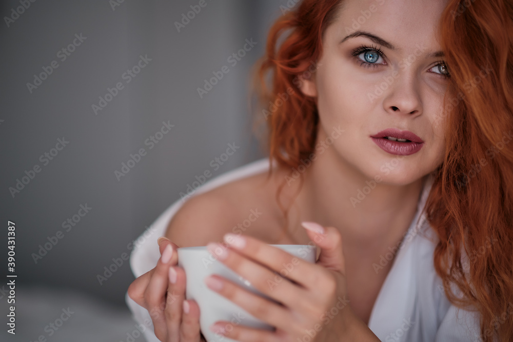 Beautiful young woman with cup of coffee at home Beautiful young woman with cup of coffee at home