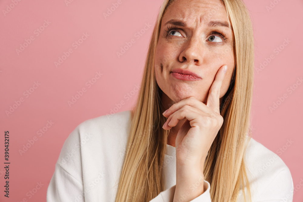 Displeased beautiful girl thinking and looking upward Displeased beautiful girl thinking and looking upward