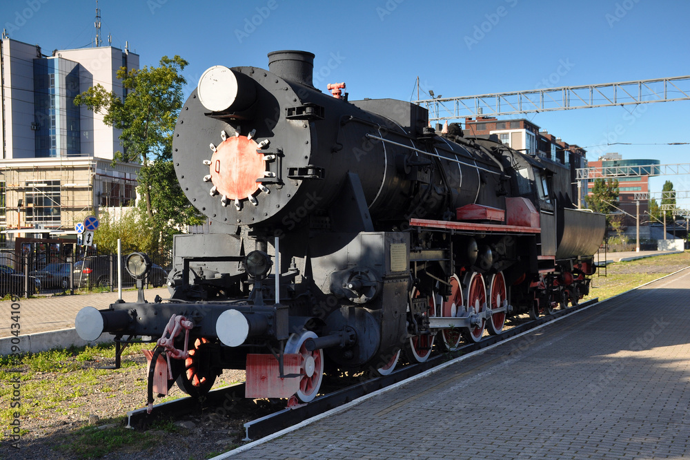 Obraz premium Vintage locomotive close-up. Train, transport, rails