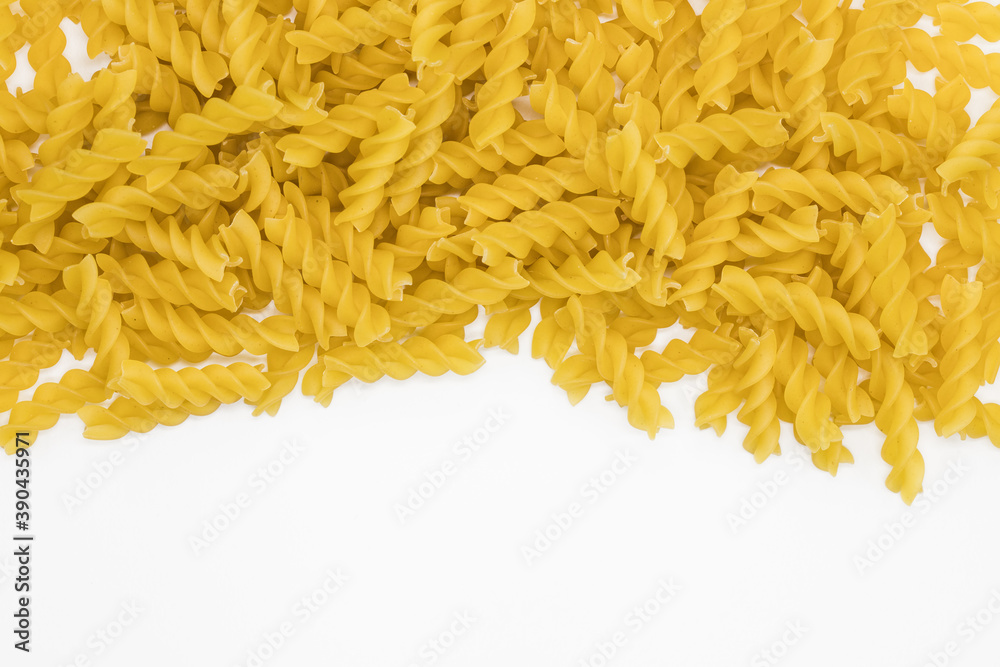 Fototapeta premium Tasty Fusilli pasta background. Healthy food textures