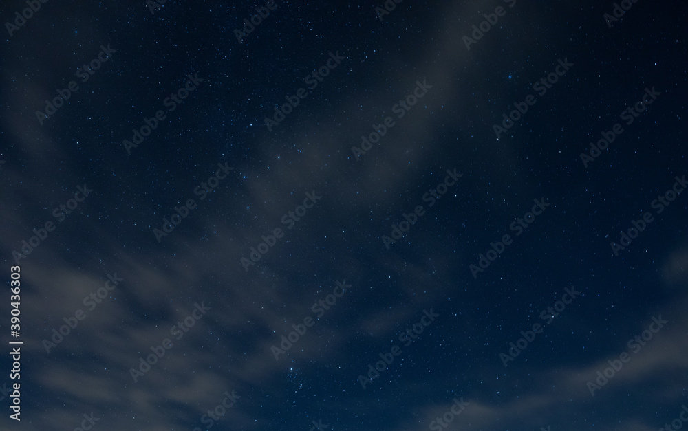 Light clouds with stars behind Light clouds with stars behind